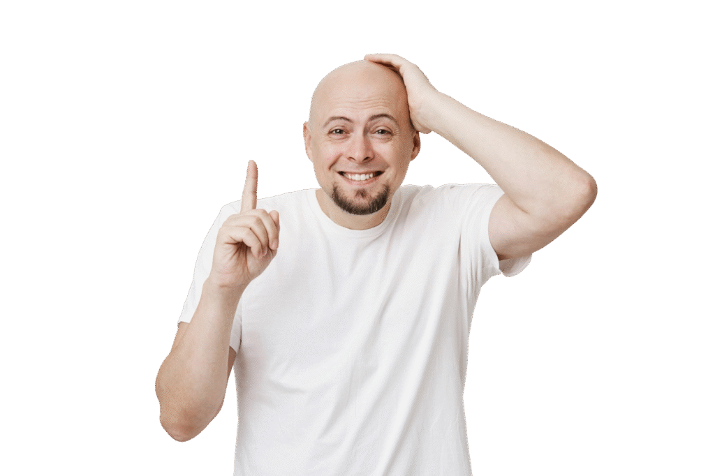 Confident bald man smiling and pointing upward, symbolizing trust and success with Turka Health hair treatments